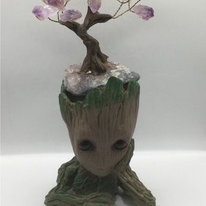 Groot planter one hand on chin